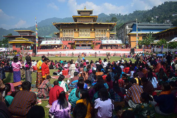 Monks perform colorful mask dances at Phuentsholing Tsechu as crowds gather to celebrate Bhutanese tradition.