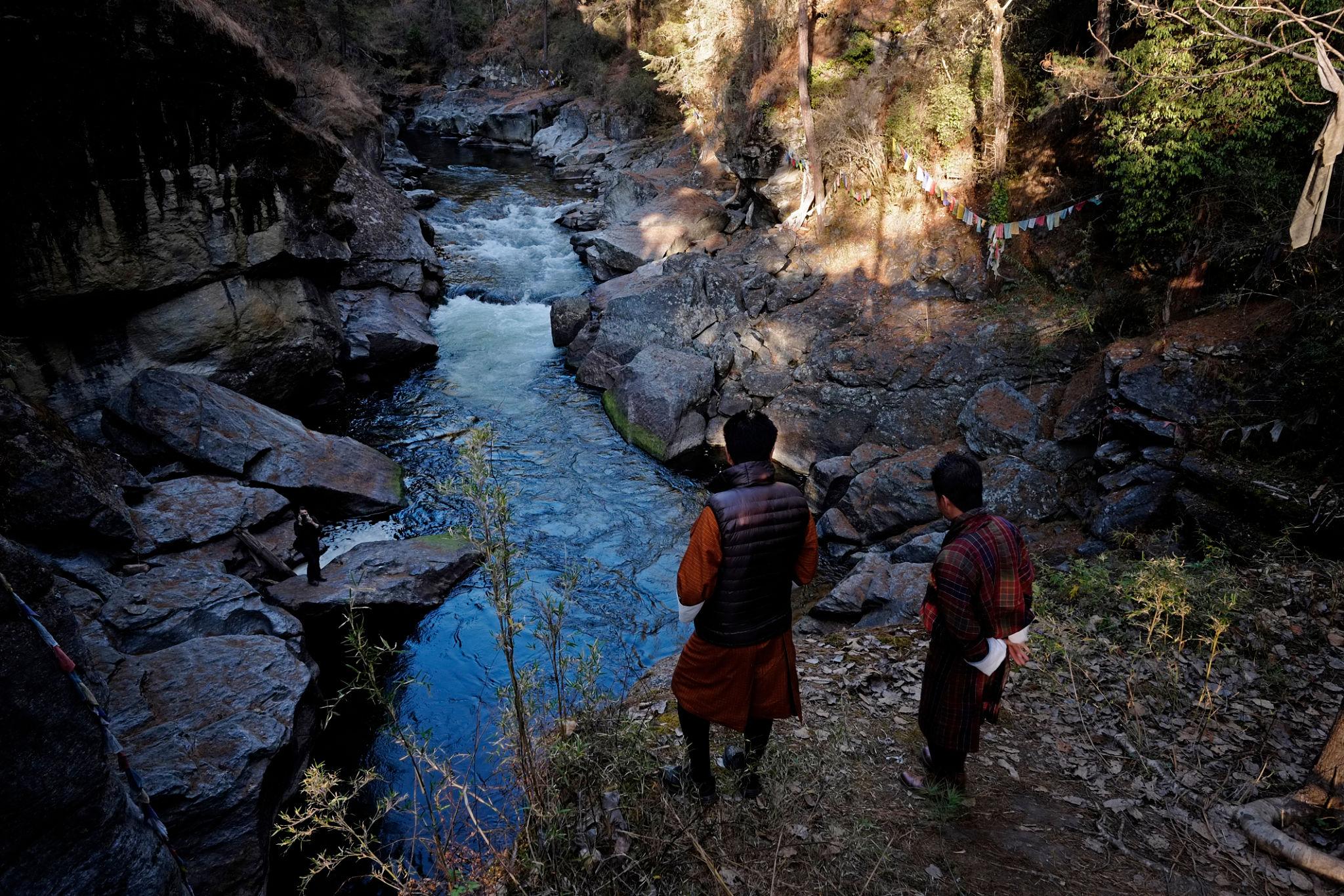 Mebar Tsho (Burning Lake) in Bumthang, Bhutan, surrounded by pine forest,and clear waters