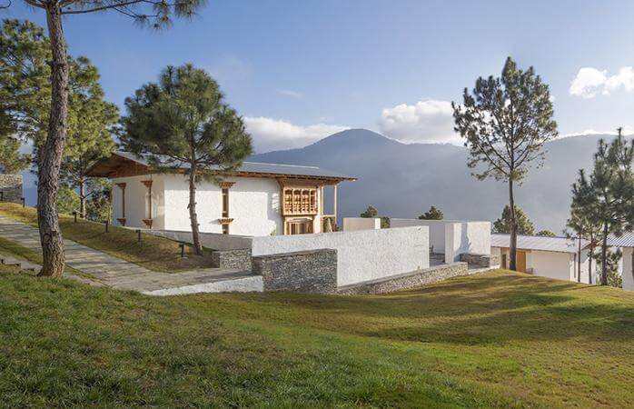 Punakha Densa Hotel with traditional Bhutanese architecture and peaceful valley surroundings.