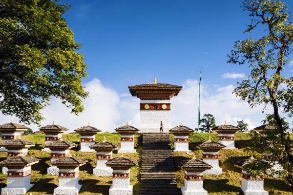 Dochula Pass in Bhutan with 108 memorial chortens and panoramic Himalayan mountain views.