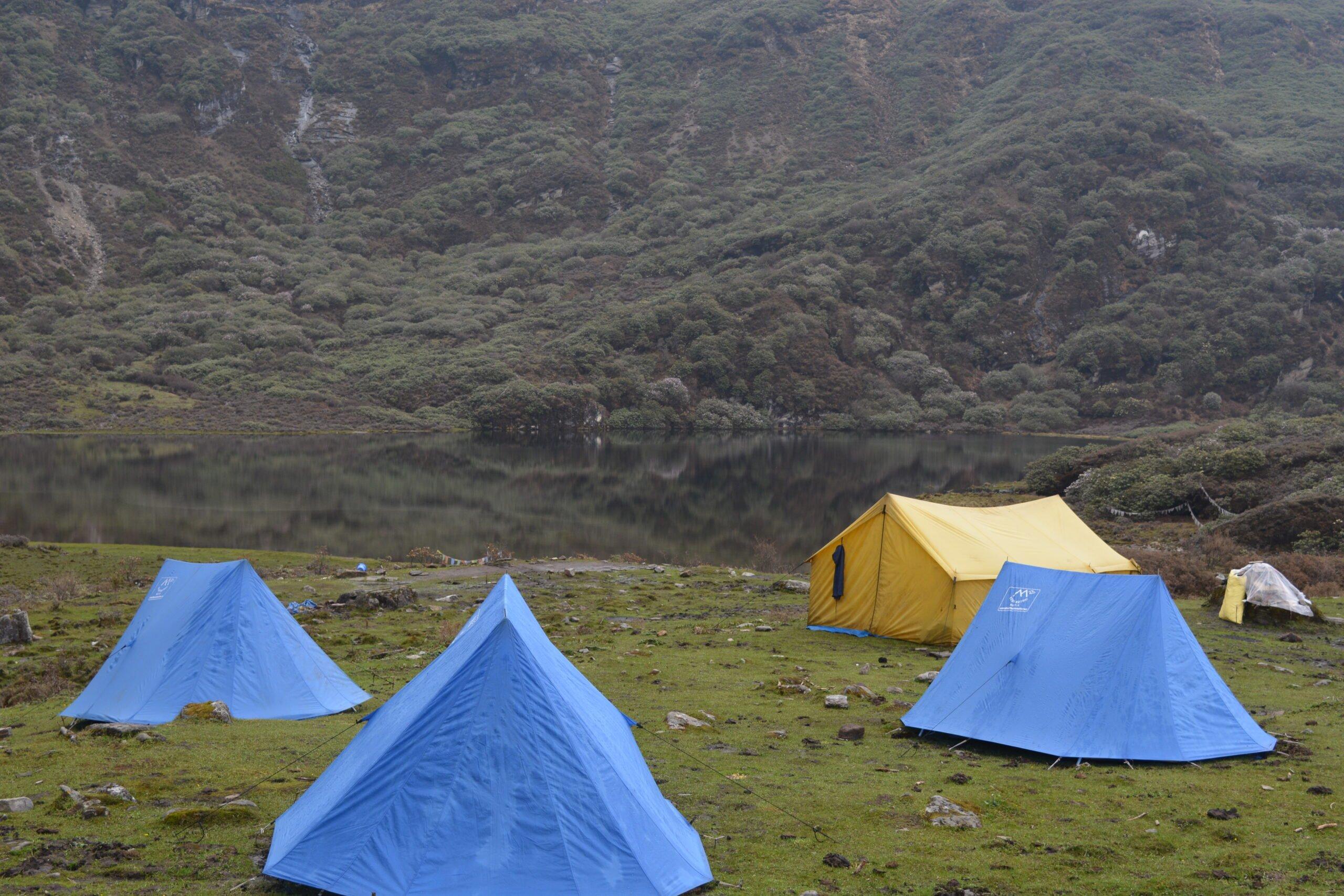 Labatama campsite along the Dagala Trek route with alpine lakes, mountain landscapes, and grazing yaks in Bhutan.