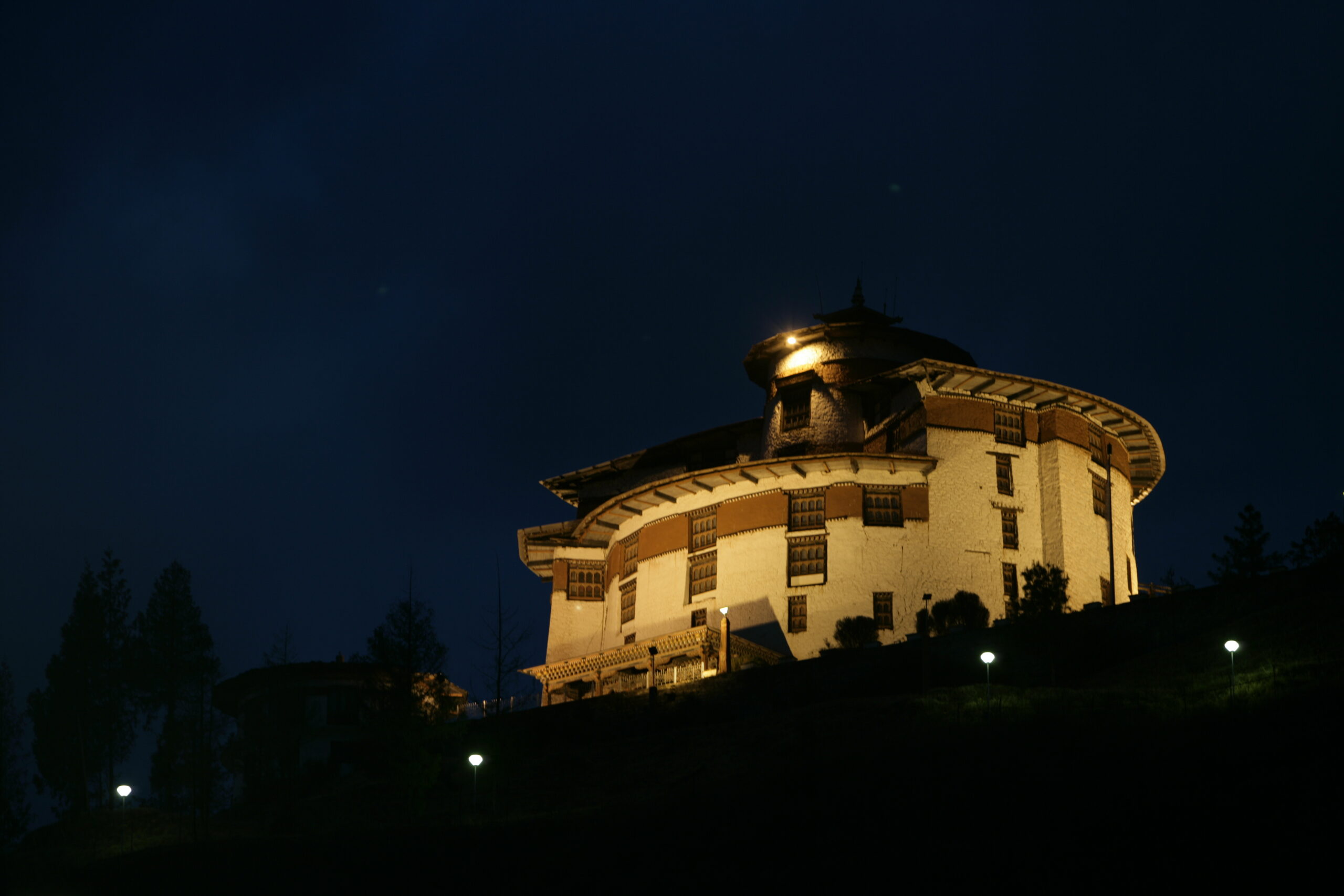 Paro Ta Dzong museum in Bhutan with traditional architecture overlooking the Paro Valley.