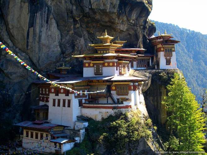 Monks and traditional buildings at Sang Choekor Buddhist College, the starting point of the Bumdra Trek in Paro.