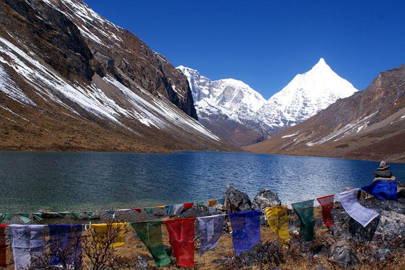 Dagala Tsho alpine lake surrounded by rocky mountains and high-altitude landscapes along the Dagala Trek in Bhutan.