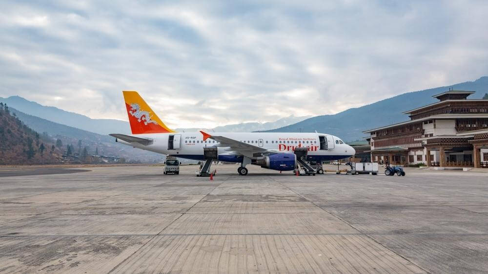 Paro International Airport surrounded by the Himalayan mountains in Bhutan.