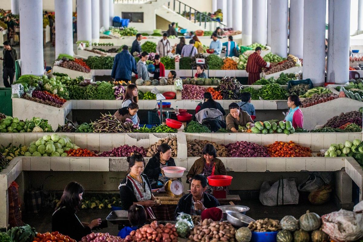 Vendors selling fresh vegetables and local produce at Thimphu's weekend vegetable market, Bhutan.